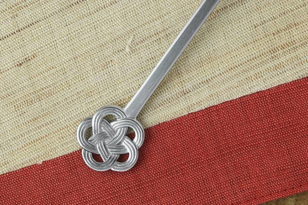 close-up of silver mizuhiki cutlery handle design