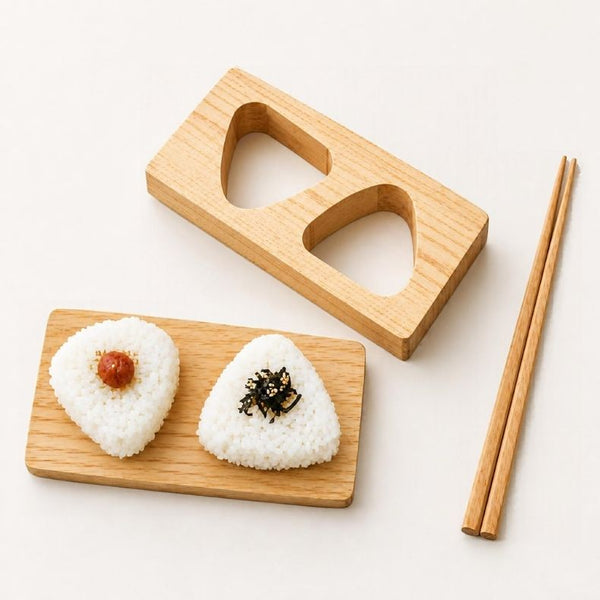 Two triangle onigiri shaped with a hinoki wooden mold